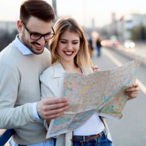 Tourist couple using map as guide